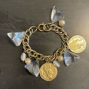 Source Unknown Gold-Tone charm Bracelet signed Germany.